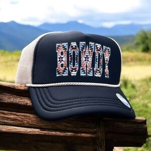 Low profile, black and ivory mesh trucker hat with a southwest HOWDY design